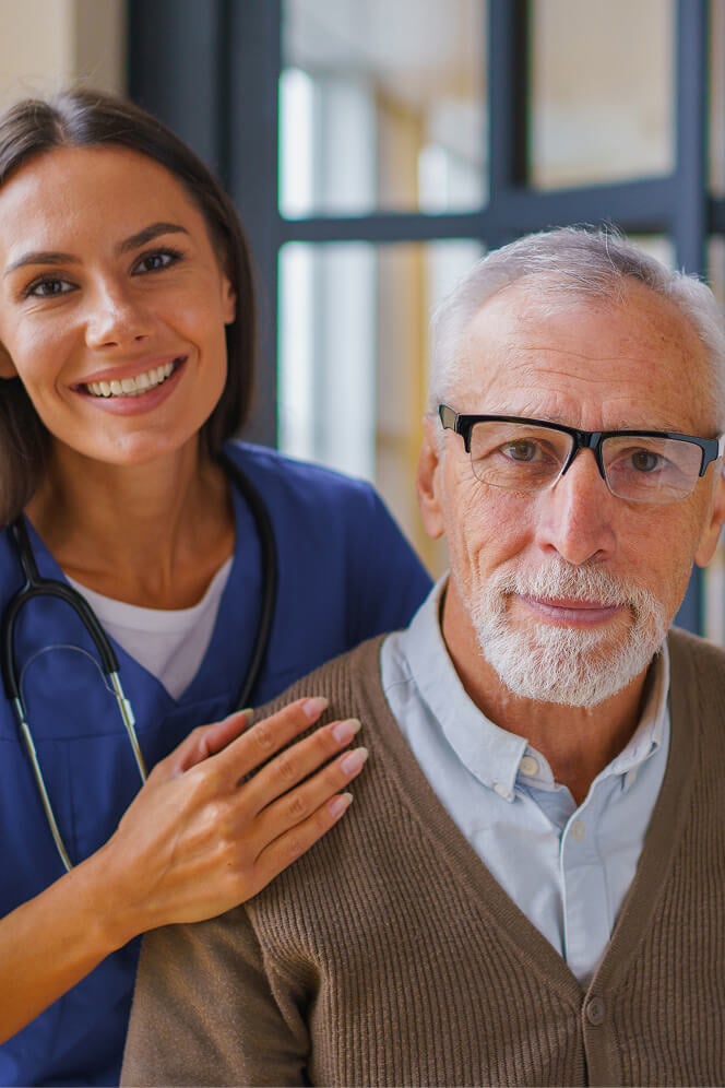 Nurse Comforting Elderly Woman at Nursing Home Colleyville